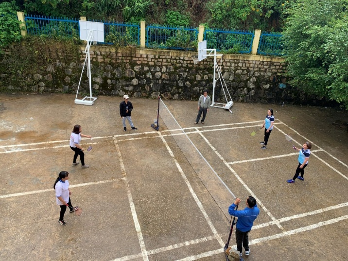 A group of people playing volleyball Description automatically generated